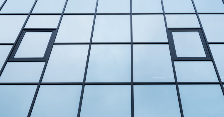 Assuring internally built AI agents: abstract corporate technology visualisation conveying shadow AI agents running inside an organisation