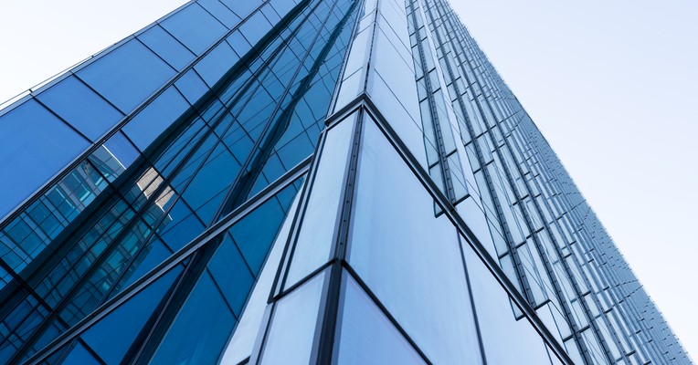 How to test for prompt injection: the glass corner of an office tower where facade planes converge to a single edge