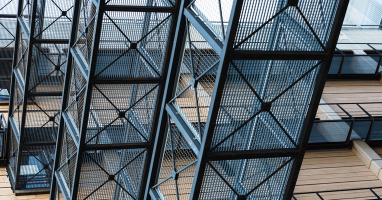 MCP server security checklist: layered metal grid panels with diagonal bracing forming a rigid blue structural lattice