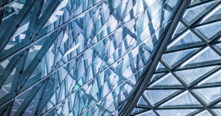 Stealth AI: a diagonal glass lattice whose overlapping panes make what sits behind them hard to read